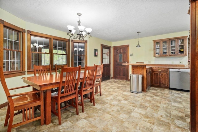 8495 Hwy N, Mountain Grove, MO 65711 - dining room featuring a chandelier and a textured ceiling