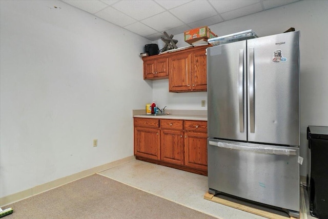 8495 Hwy N, Mountain Grove, MO 65711 - kitchen with freestanding refrigerator, brown cabinets, light countertops, a drop ceiling, and a sink