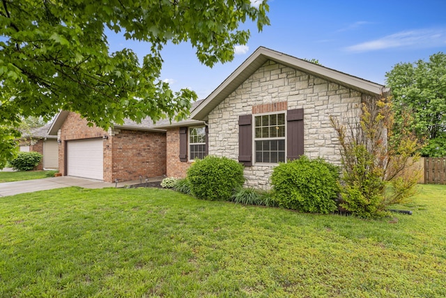 734 N Allison St, Nixa, MO 65714 - view of front of property with stone siding, a garage, driveway, and brick siding