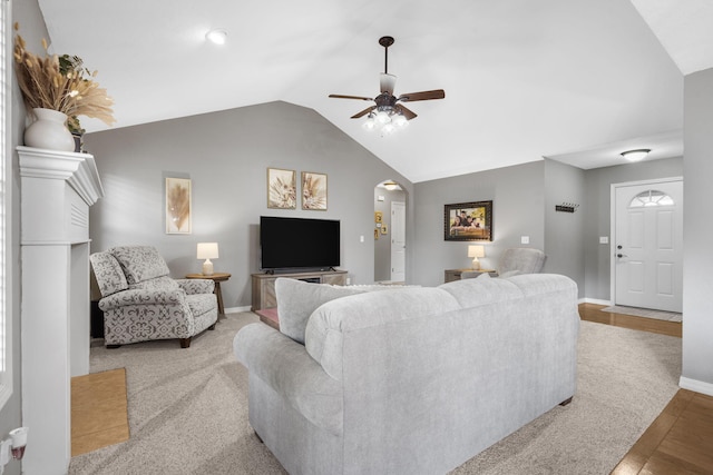 734 N Allison St, Nixa, MO 65714 - living room featuring vaulted ceiling, baseboards, a ceiling fan, arched walkways, and wood finished floors