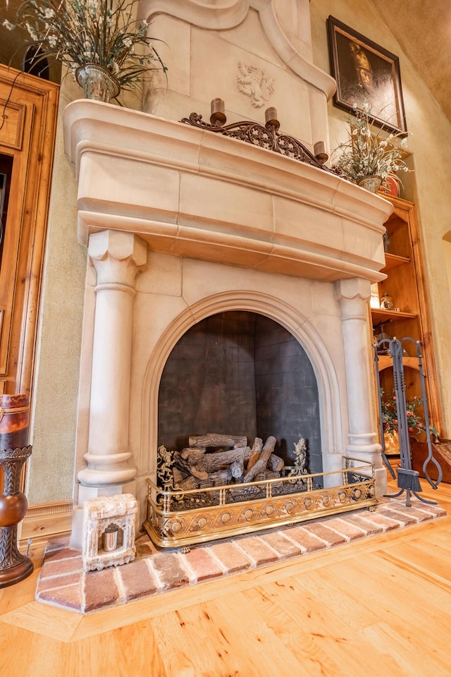 2172 E Farm Road 48, Springfield, MO 65803 - detailed view of wood finished floors, a fireplace with raised hearth, and ornate columns