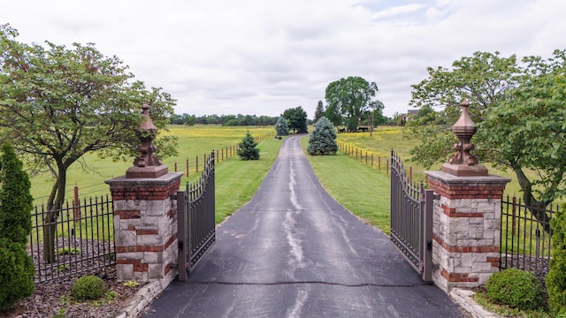 2172 E Farm Road 48, Springfield, MO 65803 - view of asphalt driveway featuring a gate, a view of countryside, and a gated entry