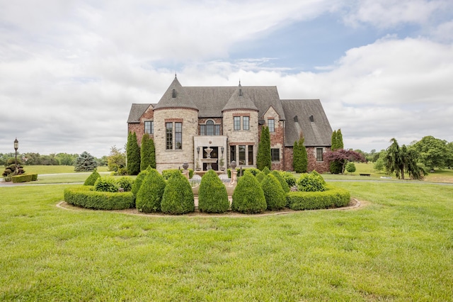 2172 E Farm Road 48, Springfield, MO 65803 - french provincial home with stone siding, a front lawn, and a shingled roof