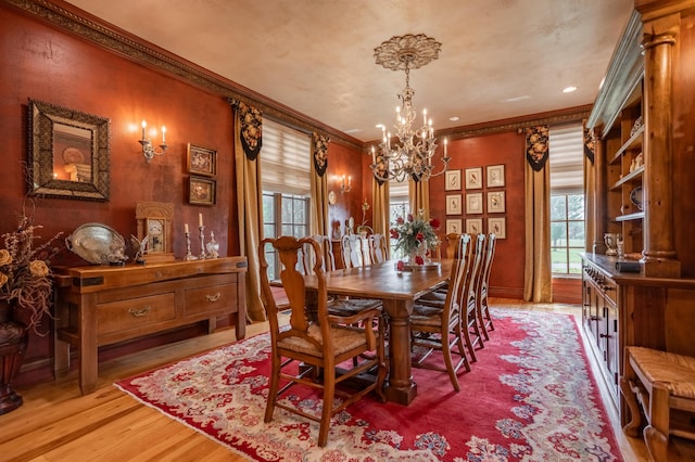 2172 E Farm Road 48, Springfield, MO 65803 - dining area with a chandelier, crown molding, and light wood-style flooring