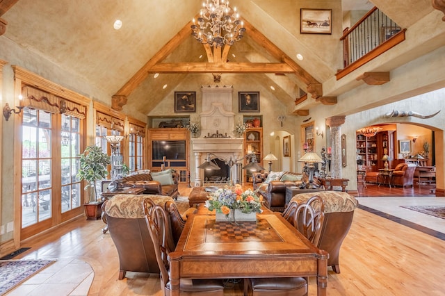 2172 E Farm Road 48, Springfield, MO 65803 - dining space with arched walkways, high vaulted ceiling, a chandelier, and beam ceiling