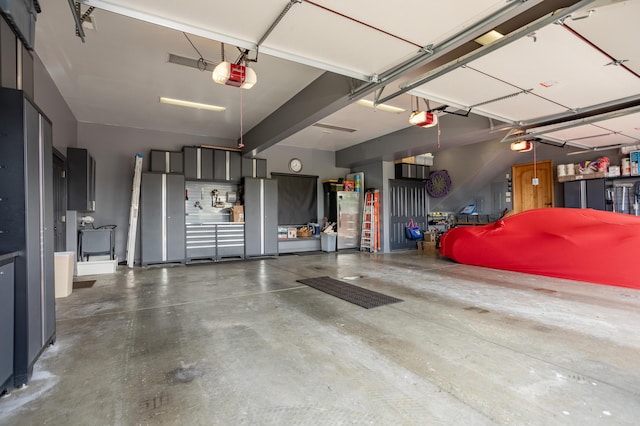 2172 E Farm Road 48, Springfield, MO 65803 - garage with a garage door opener and freestanding refrigerator