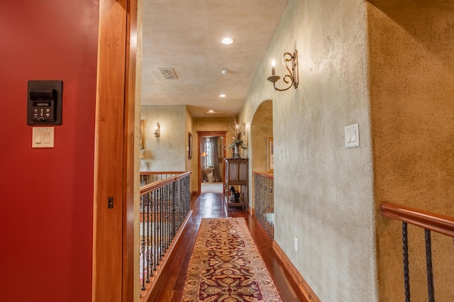2172 E Farm Road 48, Springfield, MO 65803 - corridor featuring wood finished floors, arched walkways, an upstairs landing, and recessed lighting