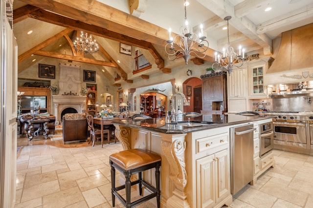 2172 E Farm Road 48, Springfield, MO 65803 - kitchen with appliances with stainless steel finishes, a chandelier, a sink, stone tile flooring, and beam ceiling