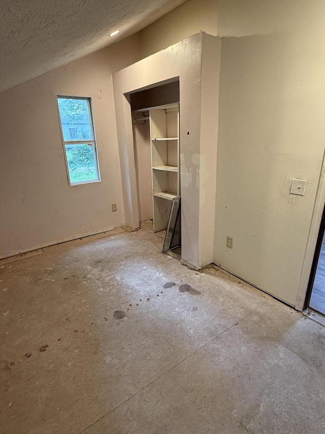 911 W Locust St, Springfield, MO 65803 - unfurnished bedroom with a closet and a textured ceiling