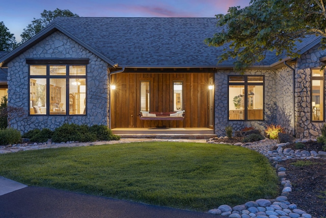 1007 Headwaters Dr, Marshfield, MO 65706 - view of front of house with stone siding, a lawn, and roof with shingles