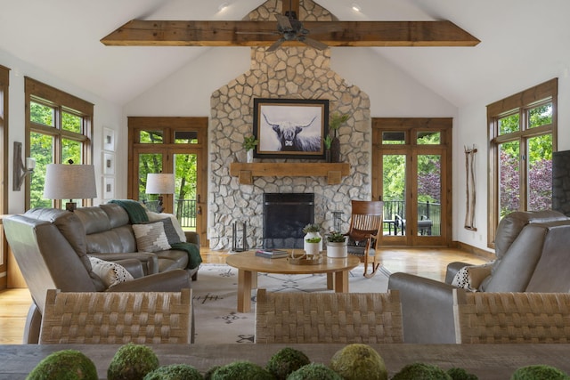 1007 Headwaters Dr, Marshfield, MO 65706 - living room featuring french doors, beamed ceiling, wood finished floors, a stone fireplace, and ceiling fan