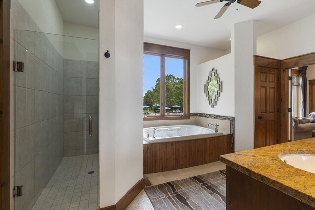 1007 Headwaters Dr, Marshfield, MO 65706 - bathroom with a bath, a shower stall, ceiling fan, recessed lighting, and vanity