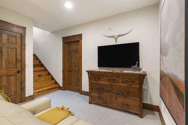 1007 Headwaters Dr, Marshfield, MO 65706 - living room with stairway, light colored carpet, and baseboards