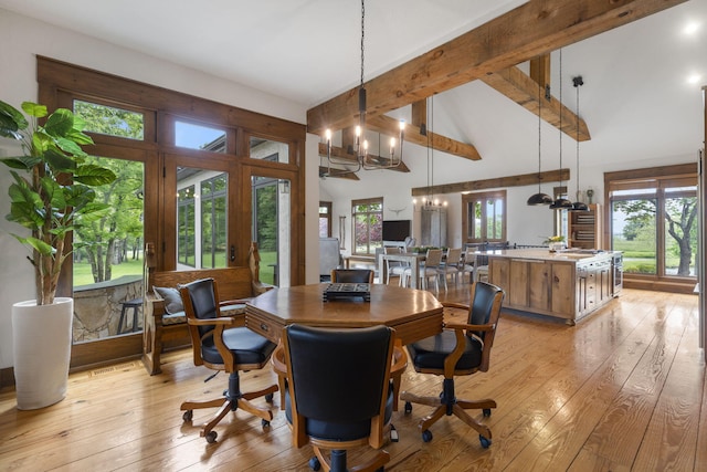 1007 Headwaters Dr, Marshfield, MO 65706 - dining room featuring light wood-style flooring, a chandelier, beam ceiling, and high vaulted ceiling