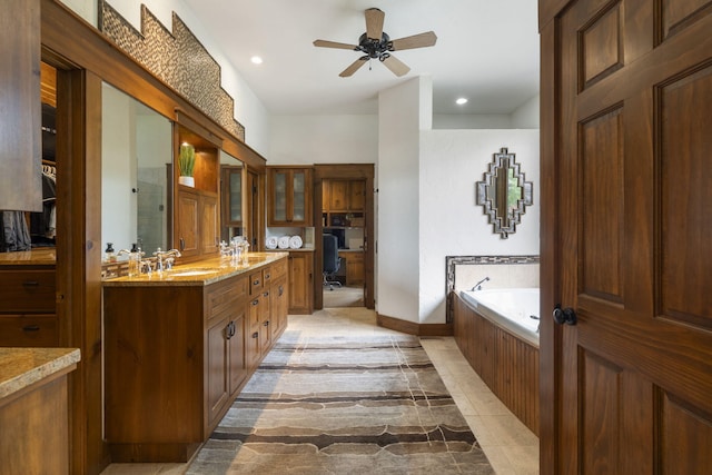 1007 Headwaters Dr, Marshfield, MO 65706 - full bath featuring double vanity, ceiling fan, a bath, recessed lighting, and baseboards