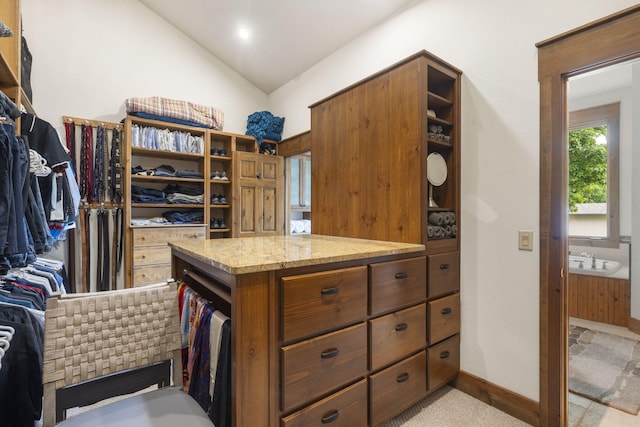 1007 Headwaters Dr, Marshfield, MO 65706 - spacious closet featuring vaulted ceiling and light colored carpet