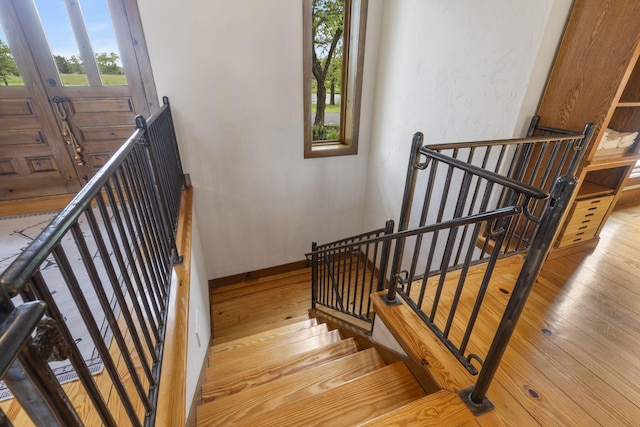 1007 Headwaters Dr, Marshfield, MO 65706 - stairs with hardwood / wood-style floors and baseboards