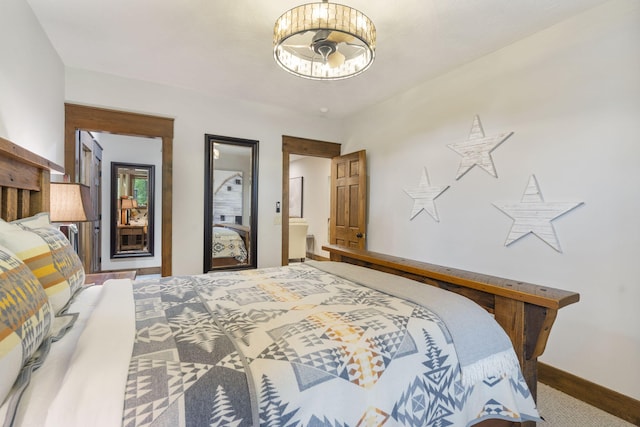 1007 Headwaters Dr, Marshfield, MO 65706 - carpeted bedroom with baseboards and a chandelier