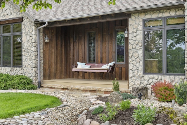 1007 Headwaters Dr, Marshfield, MO 65706 - view of exterior entry featuring stone siding and roof with shingles