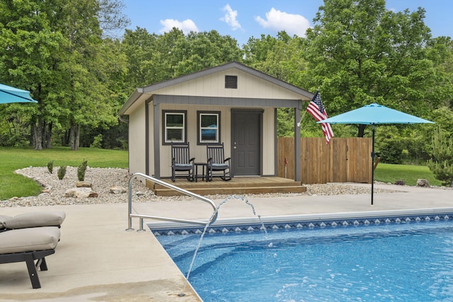 1007 Headwaters Dr, Marshfield, MO 65706 - outdoor pool featuring an outbuilding and view of wooded area