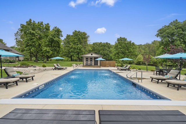 1007 Headwaters Dr, Marshfield, MO 65706 - outdoor pool with a storage structure, a patio area, an outdoor structure, and a yard