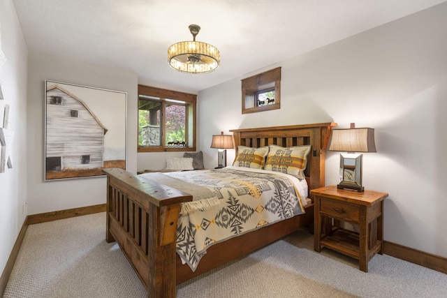 1007 Headwaters Dr, Marshfield, MO 65706 - carpeted bedroom featuring baseboards and a chandelier
