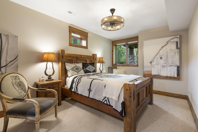 1007 Headwaters Dr, Marshfield, MO 65706 - carpeted bedroom with baseboards and a chandelier