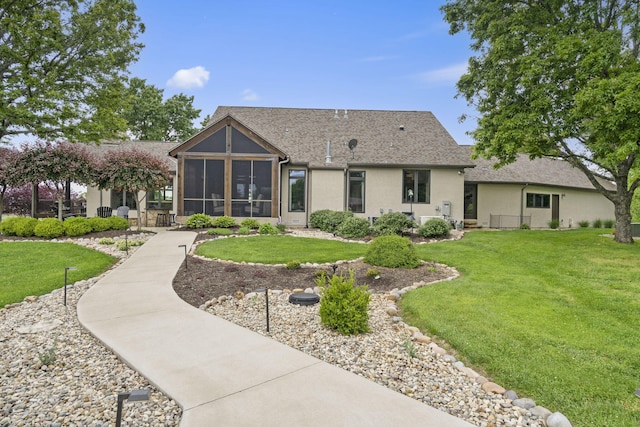 1007 Headwaters Dr, Marshfield, MO 65706 - rear view of property featuring a sunroom, a lawn, and a shingled roof