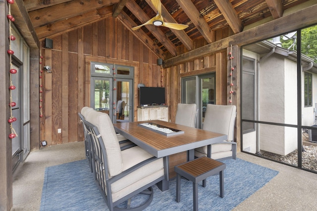 1007 Headwaters Dr, Marshfield, MO 65706 - dining room featuring lofted ceiling, wooden walls, and a ceiling fan