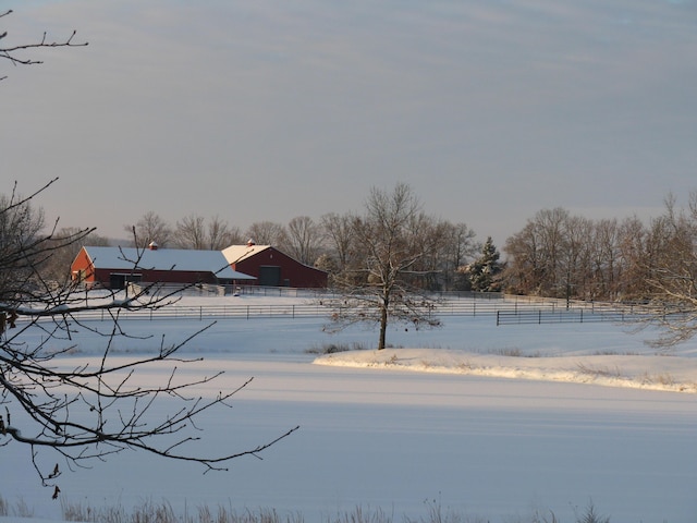 1007 Headwaters Dr, Marshfield, MO 65706 - snowy yard featuring a barn and an outdoor structure