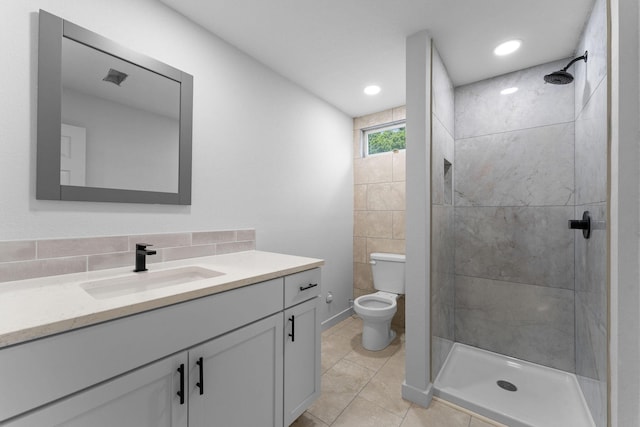 25609 Hillcrest Dr, Shell Knob, MO 65747 - bathroom with a shower stall, vanity, tile patterned flooring, toilet, and tasteful backsplash