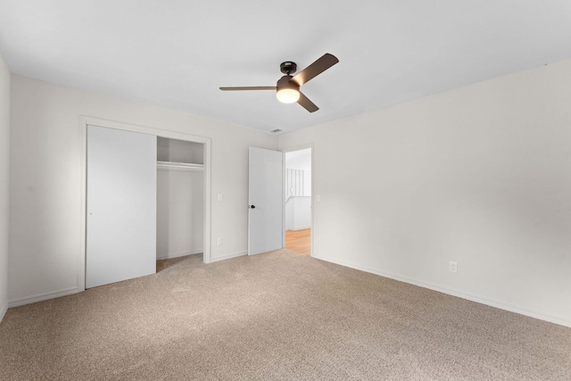 25609 Hillcrest Dr, Shell Knob, MO 65747 - unfurnished bedroom featuring light colored carpet, a closet, and ceiling fan