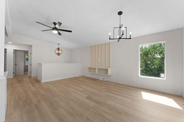 25609 Hillcrest Dr, Shell Knob, MO 65747 - unfurnished living room featuring a chandelier, light wood finished floors, lofted ceiling, and a ceiling fan