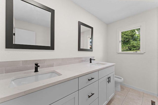 25609 Hillcrest Dr, Shell Knob, MO 65747 - full bathroom with double vanity, toilet, baseboards, and tile patterned flooring