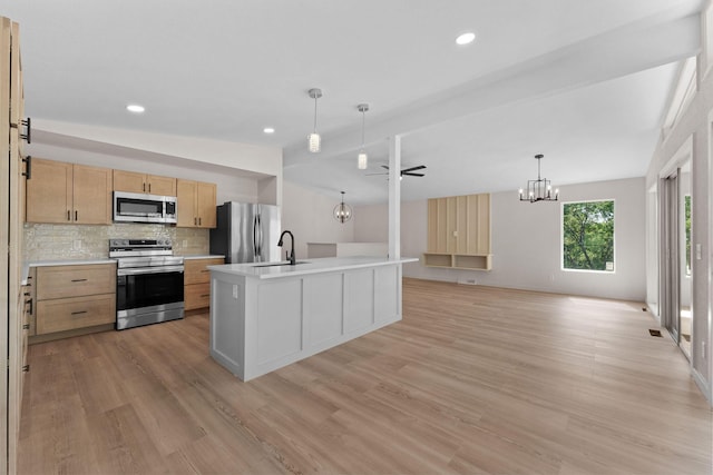 25609 Hillcrest Dr, Shell Knob, MO 65747 - kitchen featuring stainless steel appliances, light wood finished floors, light countertops, a chandelier, and decorative backsplash