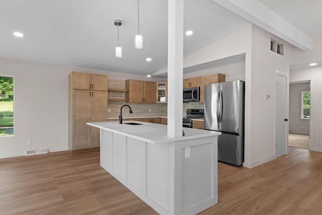 25609 Hillcrest Dr, Shell Knob, MO 65747 - kitchen featuring appliances with stainless steel finishes, a sink, open shelves, light wood-style flooring, and backsplash
