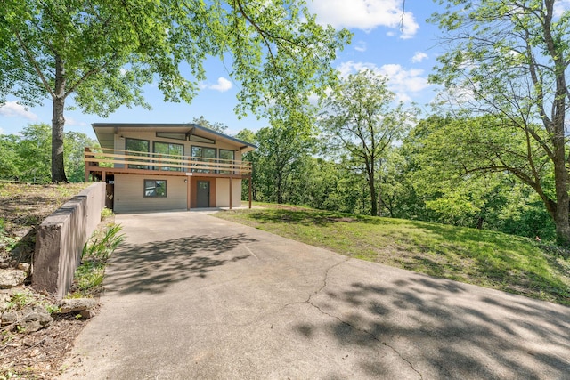 25609 Hillcrest Dr, Shell Knob, MO 65747 - view of front of home with driveway and a wooden deck