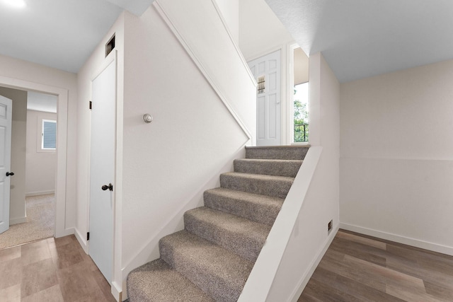 25609 Hillcrest Dr, Shell Knob, MO 65747 - staircase featuring wood finished floors and baseboards