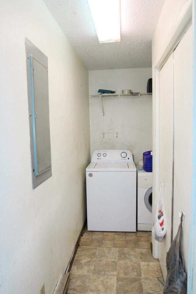 9 Carte Sq, West Plains, MO 65775 - laundry room with washing machine and dryer, electric panel, and a textured ceiling