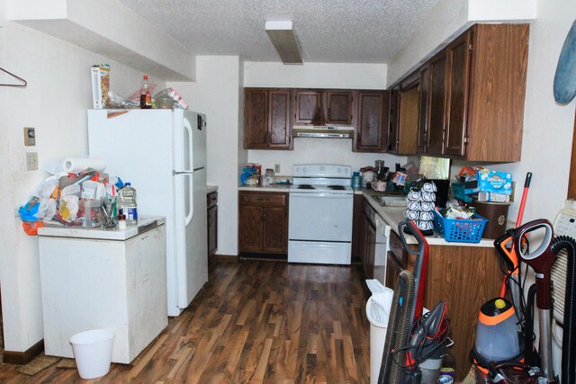 9 Carte Sq, West Plains, MO 65775 - kitchen with white appliances, dark wood-style floors, light countertops, a textured ceiling, and under cabinet range hood
