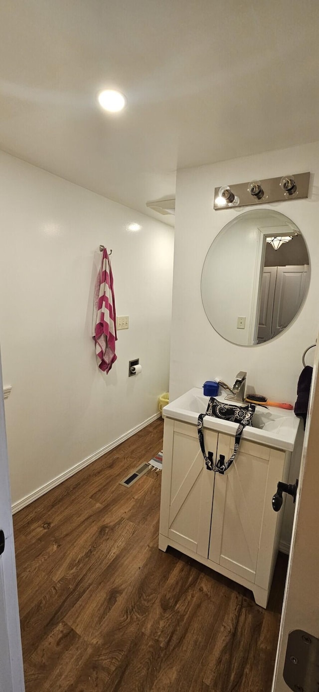182 Cathy St, Branson, MO 65616 - bathroom with wood finished floors, vanity, and baseboards