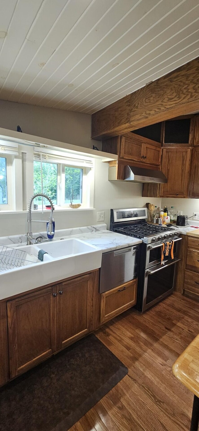182 Cathy St, Branson, MO 65616 - kitchen with double oven range, under cabinet range hood, dark wood finished floors, and a sink