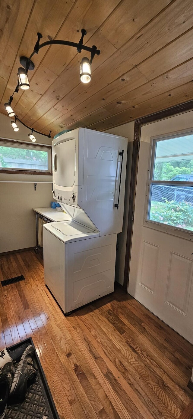 182 Cathy St, Branson, MO 65616 - laundry room featuring stacked washer / drying machine, wooden ceiling, wood finished floors, and plenty of natural light