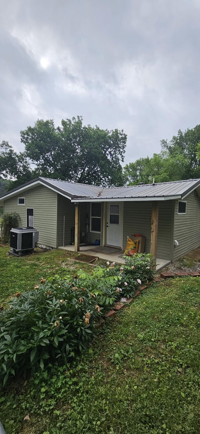182 Cathy St, Branson, MO 65616 - back of house with central AC unit and metal roof