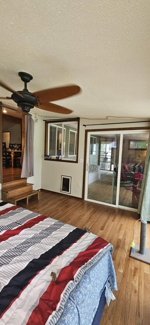 182 Cathy St, Branson, MO 65616 - bedroom with a textured ceiling and wood finished floors