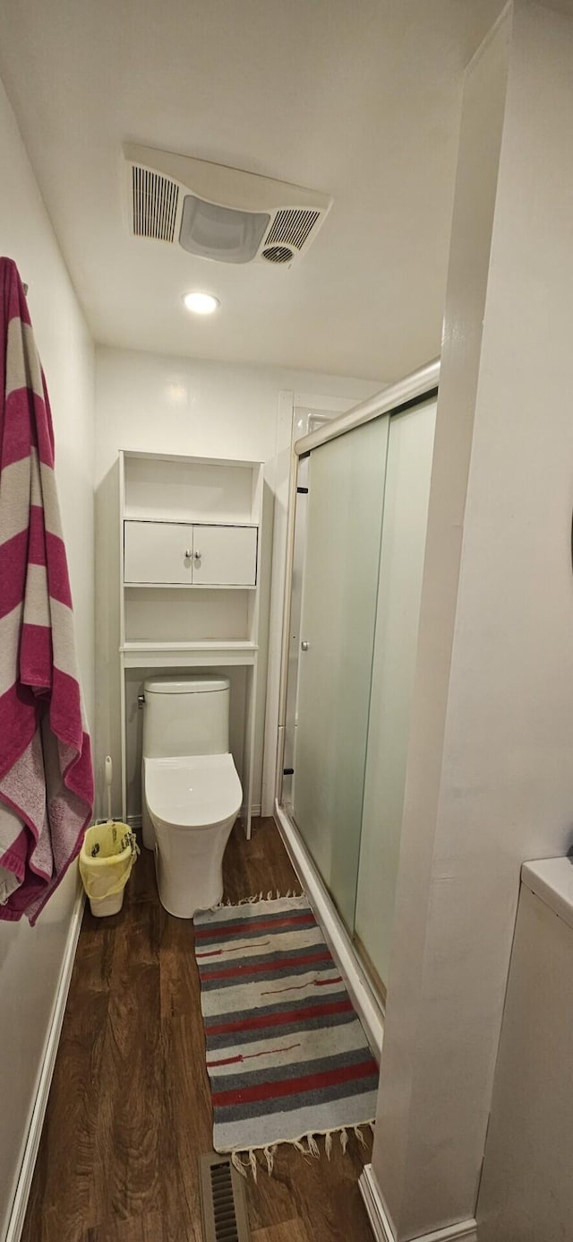 182 Cathy St, Branson, MO 65616 - bathroom with wood finished floors, a stall shower, toilet, and recessed lighting