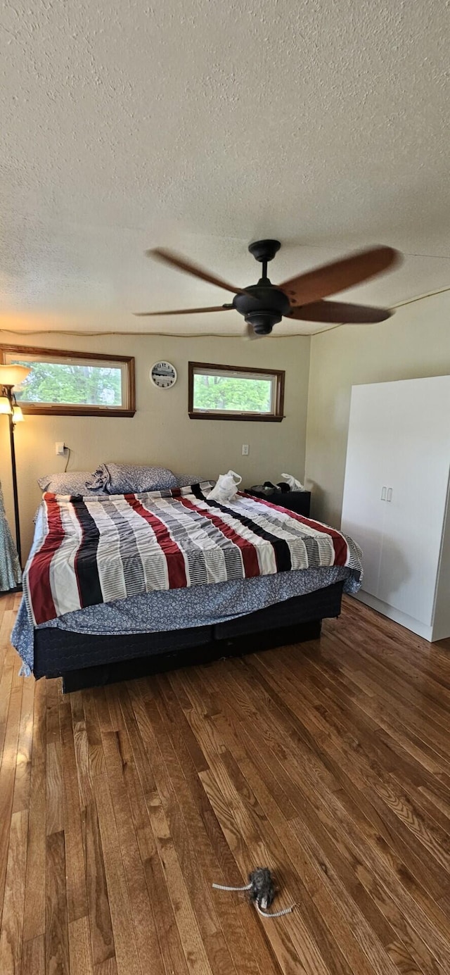 182 Cathy St, Branson, MO 65616 - bedroom featuring hardwood / wood-style flooring, a textured ceiling, and a ceiling fan
