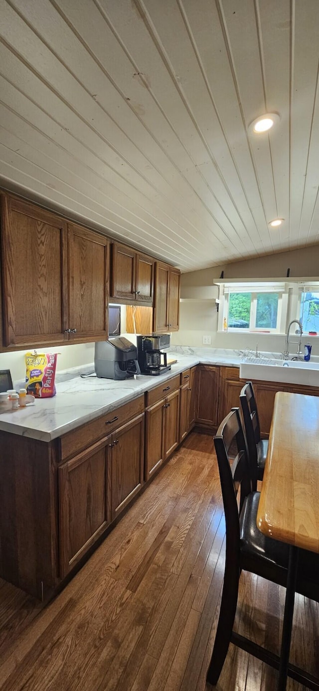 182 Cathy St, Branson, MO 65616 - kitchen featuring dark wood finished floors, light countertops, open shelves, brown cabinets, and recessed lighting
