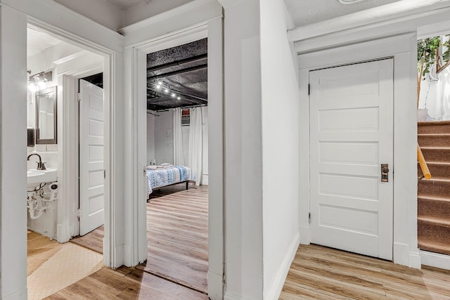 1200 E Walnut St, Springfield, MO 65802 - hall with light wood finished floors and stairway