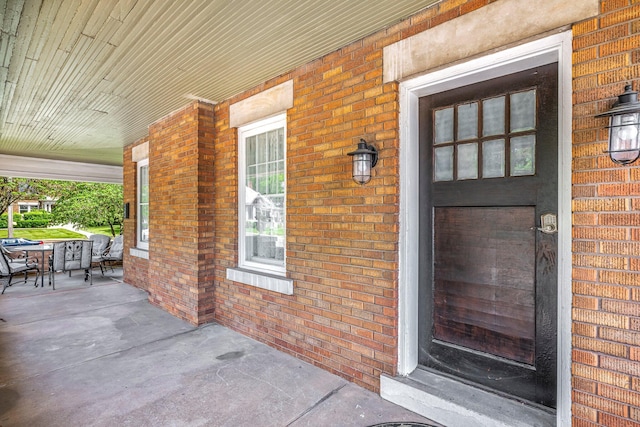 1200 E Walnut St, Springfield, MO 65802 - entrance to property featuring covered porch and brick siding